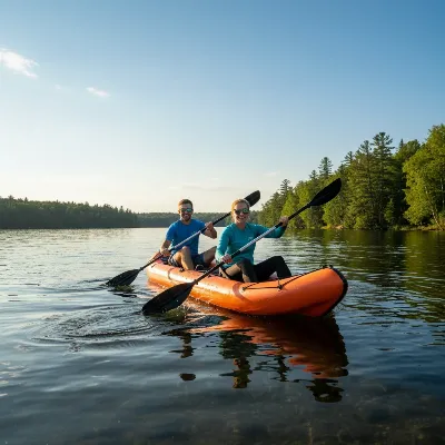 Two people paddling a bright inflatable kayak on a sunny lake, demonstrating teamwork.